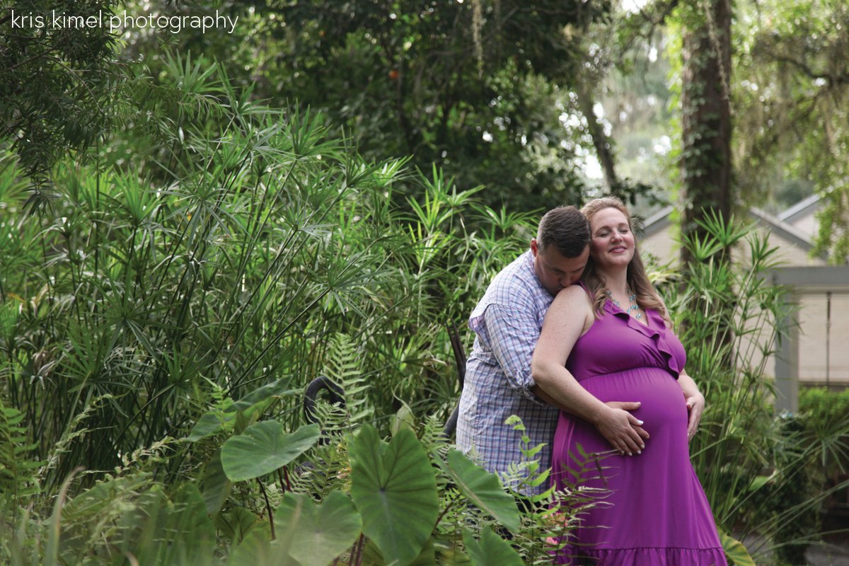 Maternity portrait of happy couple at Oven Park in Tallahssee, FL