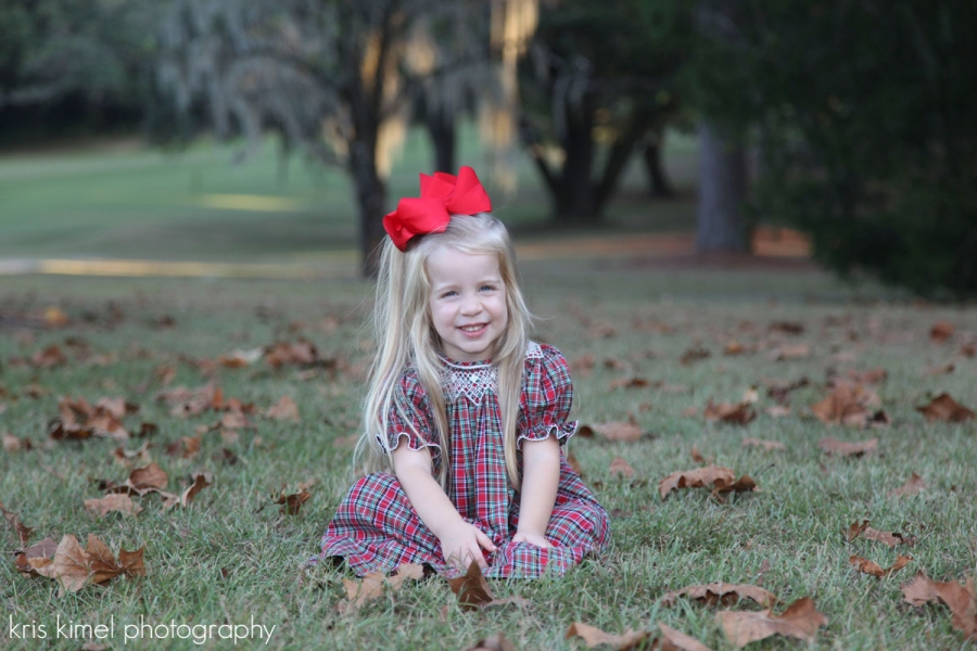 Holiday ortrait of a smiling little girl at Killearn Country Club in Tallahassee, Florida