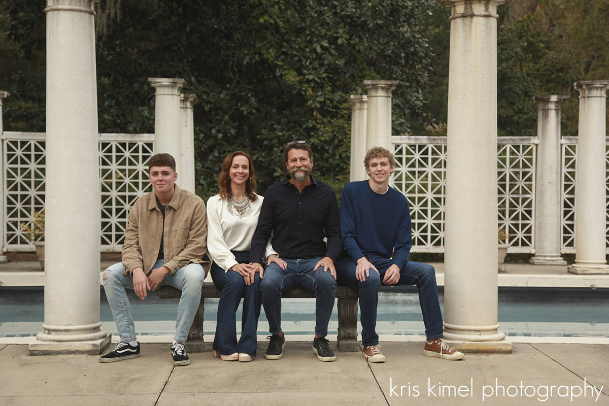 Portrait of a family at the Goodwood Plantation pool by Kris Kimel Photography