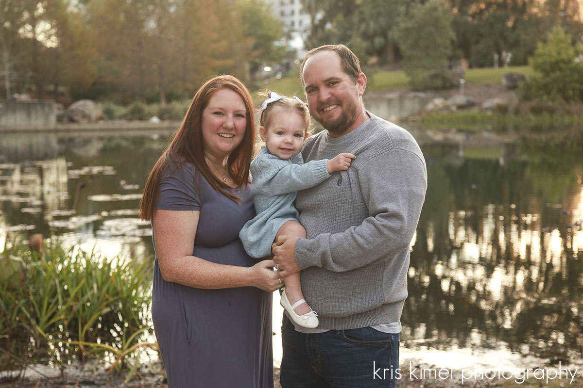 Family portrait of mother, father, and toddler at Cascades Park in Tallahassee FL by Kris Kimel Photograhy 